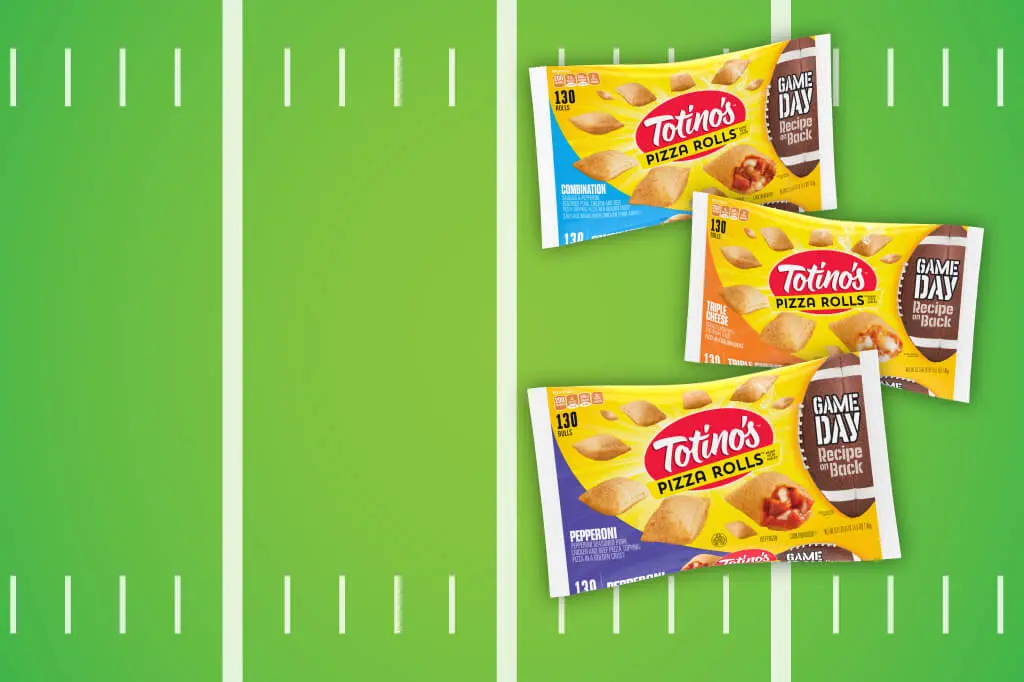 Three packages of Totino's Pizza Rolls, Combination, Pepperoni and Triple Cheese, on a football field.